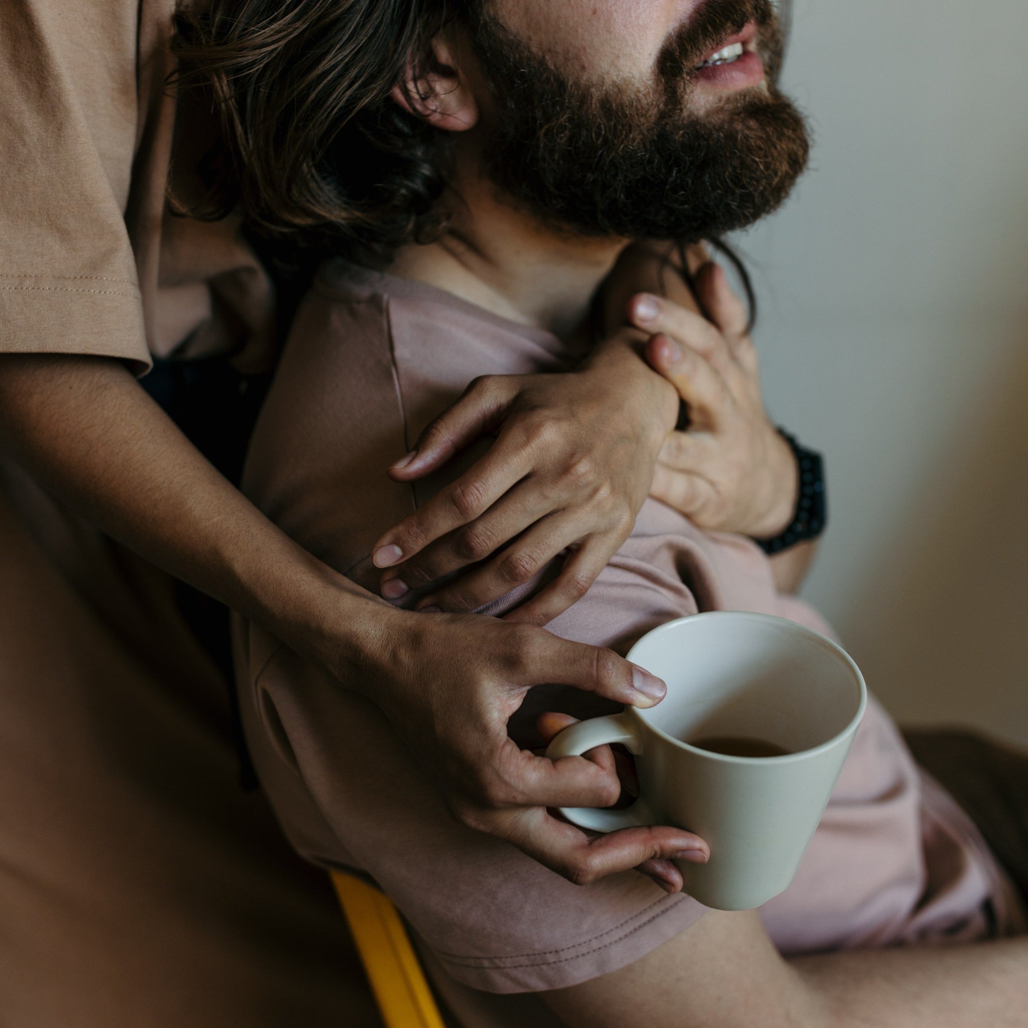 A man being hugged