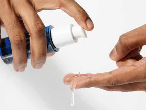 A person pouring MyMuse's Glide Silicone jelly