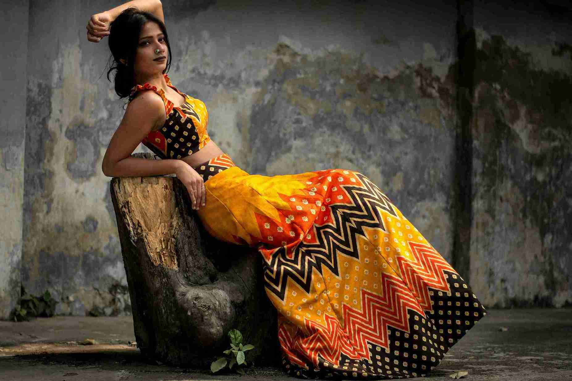  Photo of Woman Leaning on Tree Trunk 