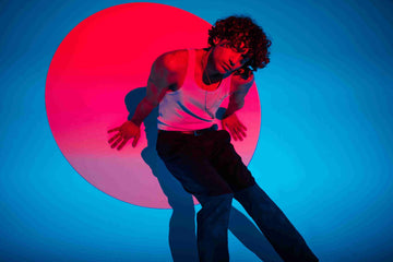  Man in White Tank Top With Red Light Reflection On Face